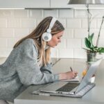 Woman-Listening-to-Headphones-150x150-1